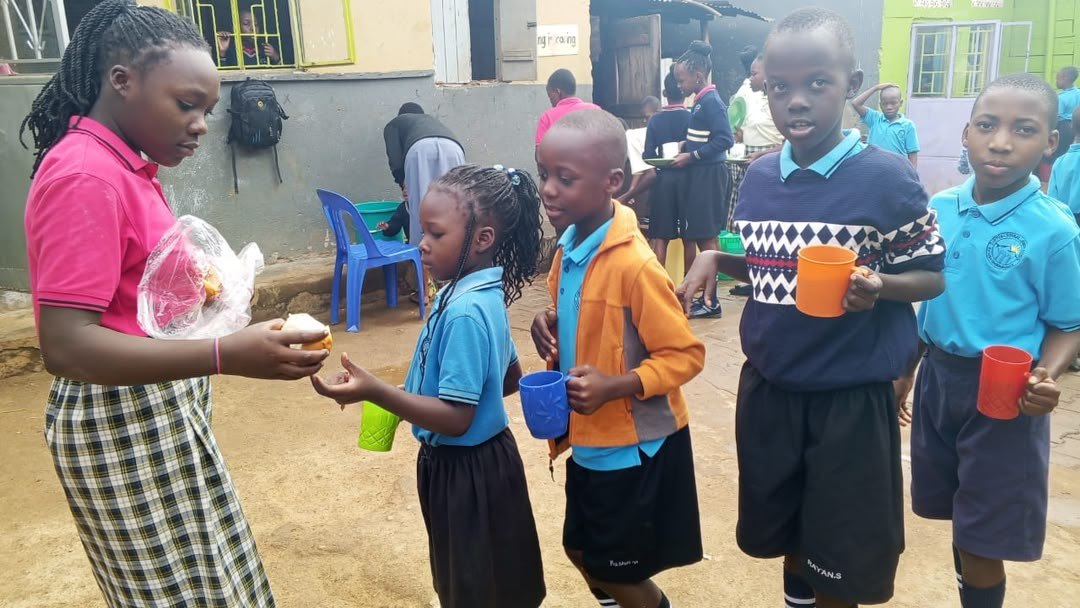 Ugandan schoolchildren receiving daily nutritious snacks